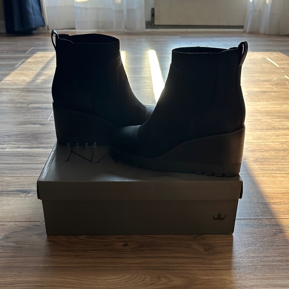 Women’s black wedge booties